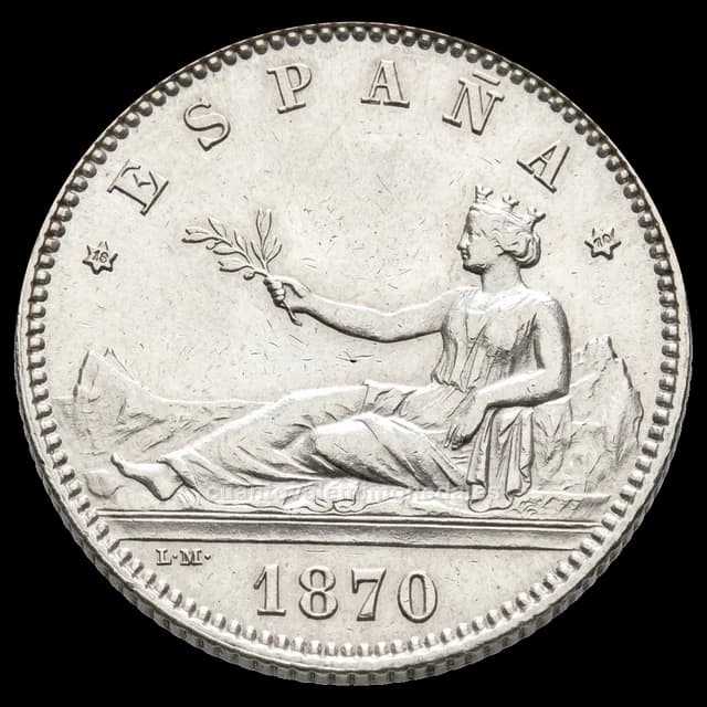 Imagen orientativa: 1 peseta 1870 Gobierno Provisional (plata), estrellas 18-70 SNM y 18-73 DEM